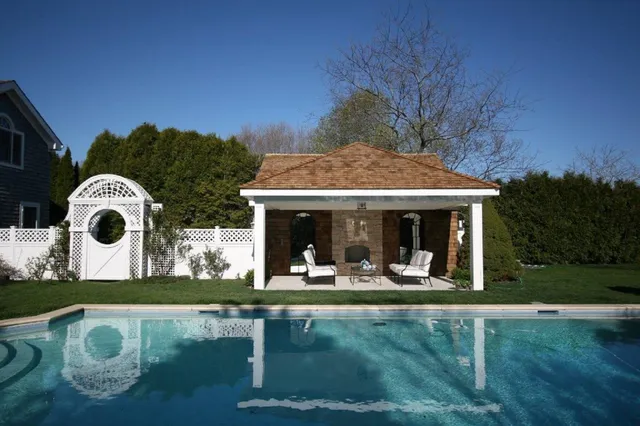 a front view of house with yard and outdoor seating