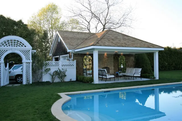 a front view of house with yard and outdoor seating