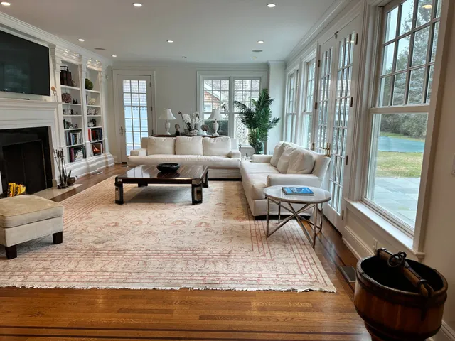 a living room with furniture and a fireplace