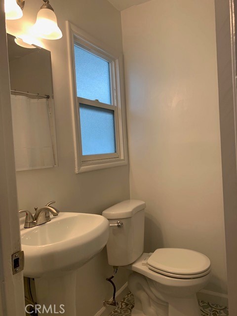 1809 East 4th Street, Unit 3 Long Beach, CA 90802 - Photo 9 of 10 a bathroom with a sink toilet and mirror