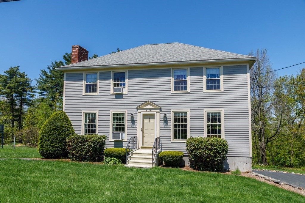 202 Leo Drive Gardner, MA 01440 - Photo 2 of 26 a front view of a house with a yard
