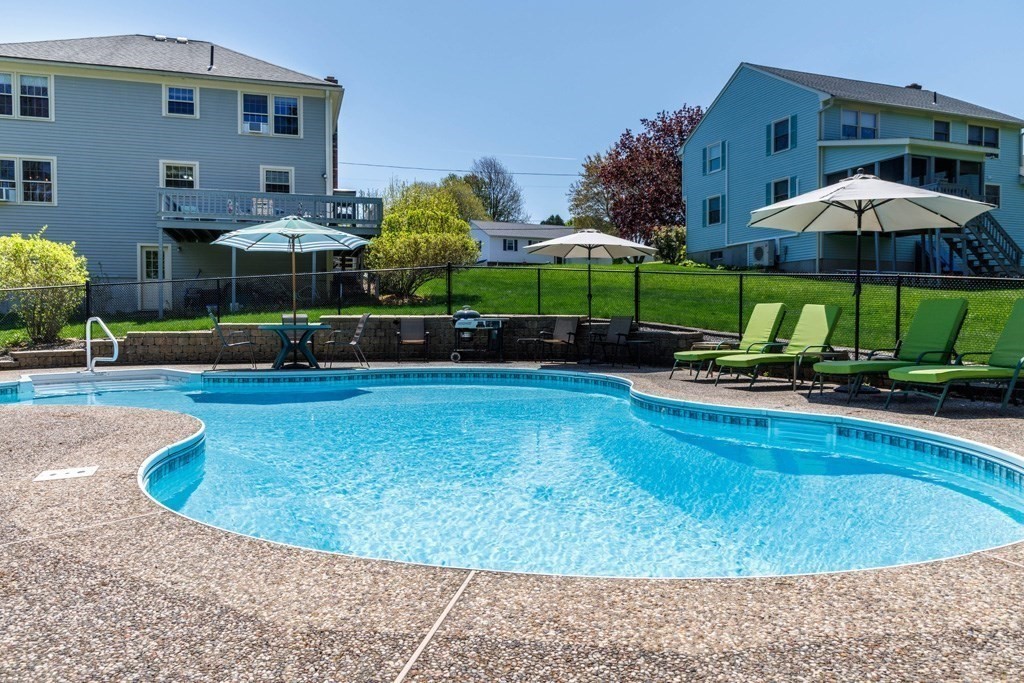 202 Leo Drive Gardner, MA 01440 - Photo 21 of 26 a swimming pool with outdoor seating yard and barbeque oven