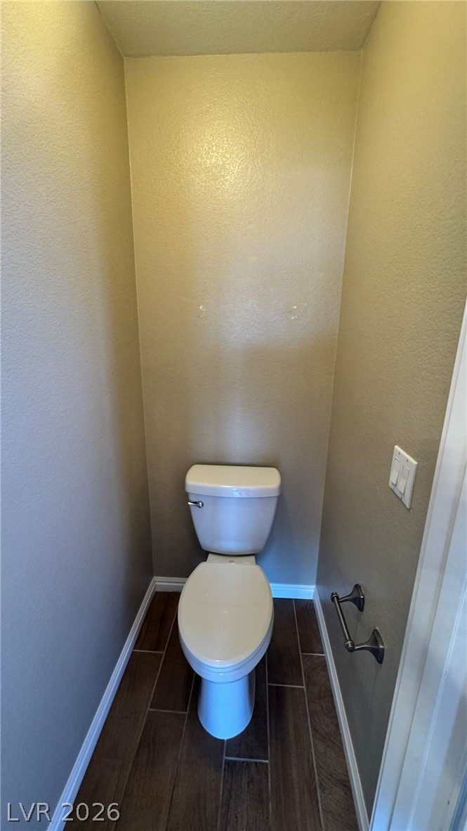 9716 Ridge Creek Place Las Vegas, NV 89134 - Photo 25 of 28 This compact water closet offers essential functionality with durable flooring.