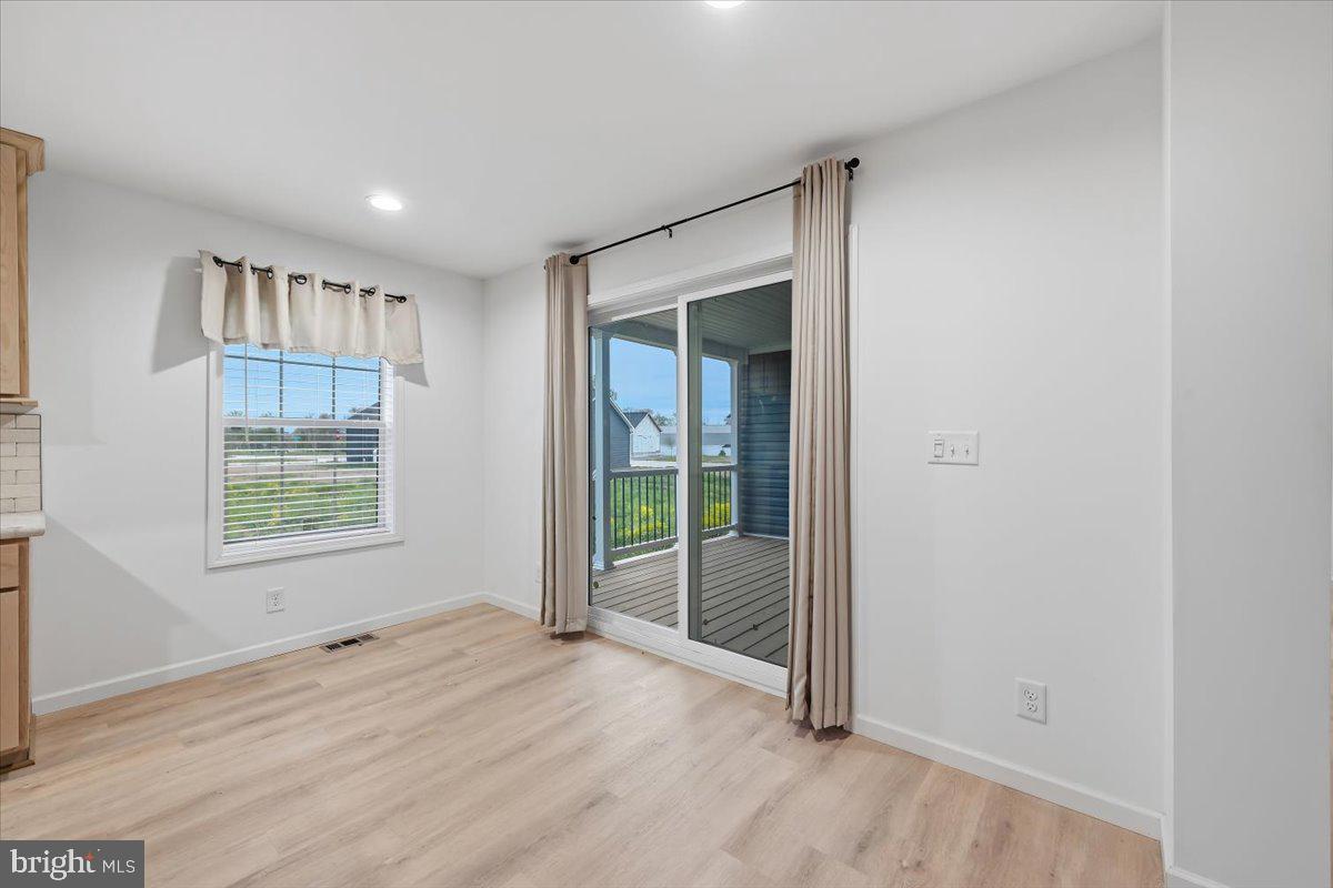 3987 Hastings Road Walnutport, PA 18088 - Photo 11 of 40 an empty room with wooden floor and windows