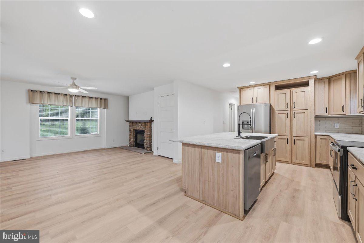 3987 Hastings Road Walnutport, PA 18088 - Photo 12 of 40 a kitchen with stainless steel appliances granite countertop a stove and a sink