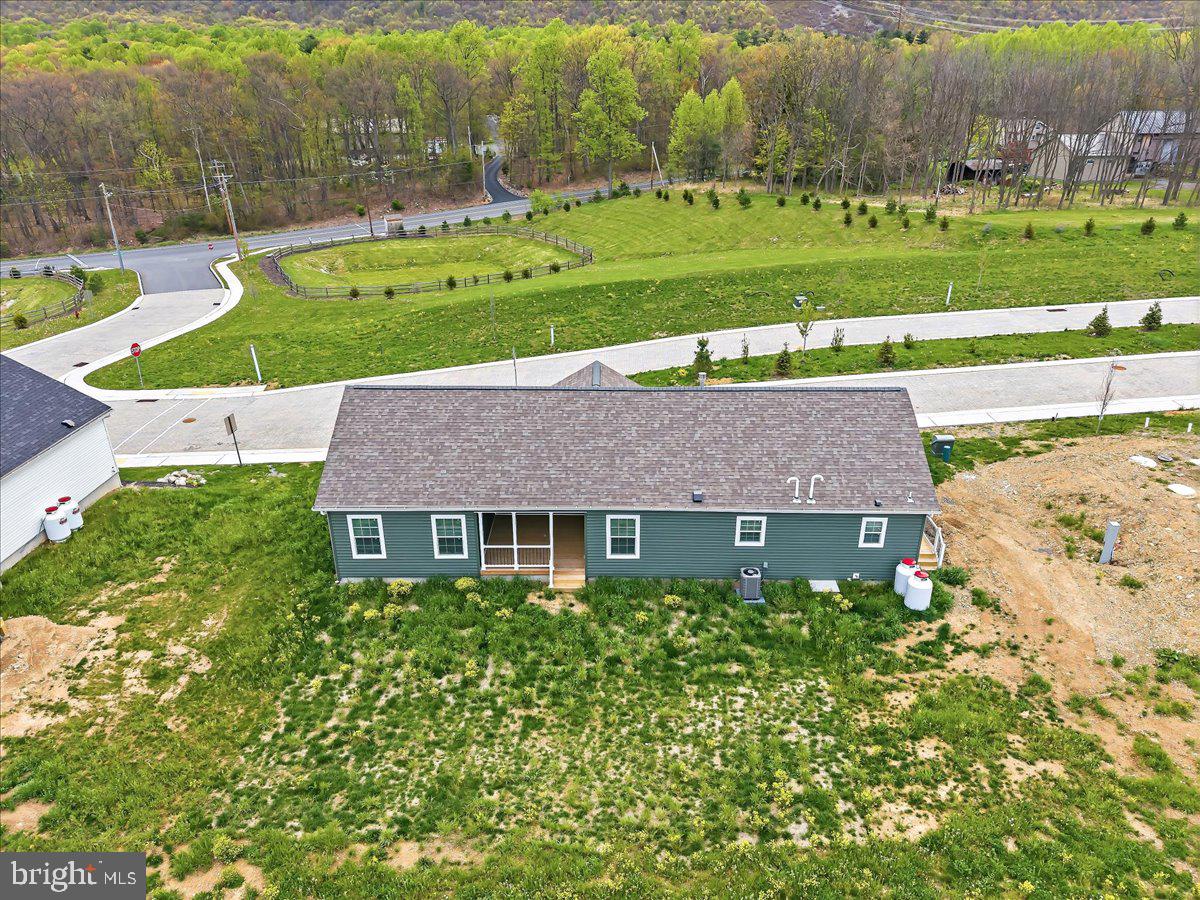 3987 Hastings Road Walnutport, PA 18088 - Photo 3 of 40 a aerial view of a house with a yard and table and chairs