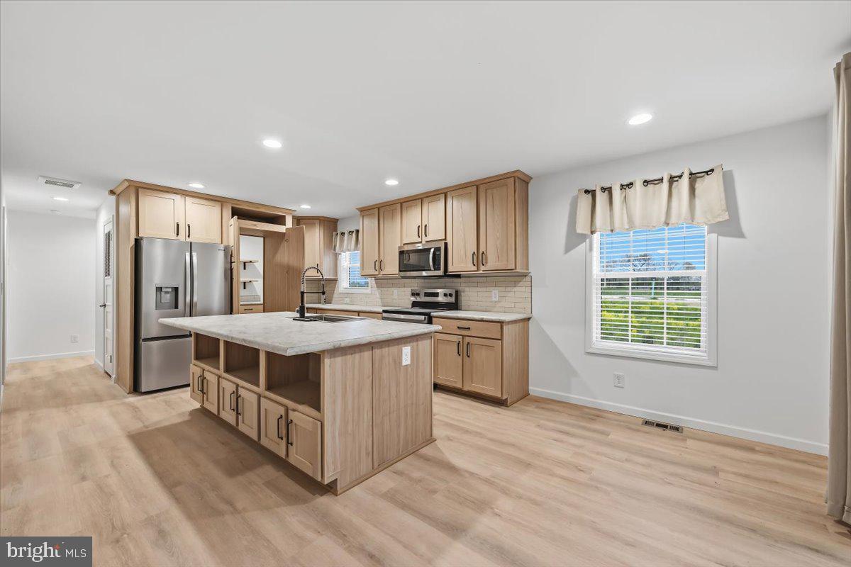 3987 Hastings Road Walnutport, PA 18088 - Photo 9 of 40 a kitchen with stainless steel appliances granite countertop a stove and a refrigerator