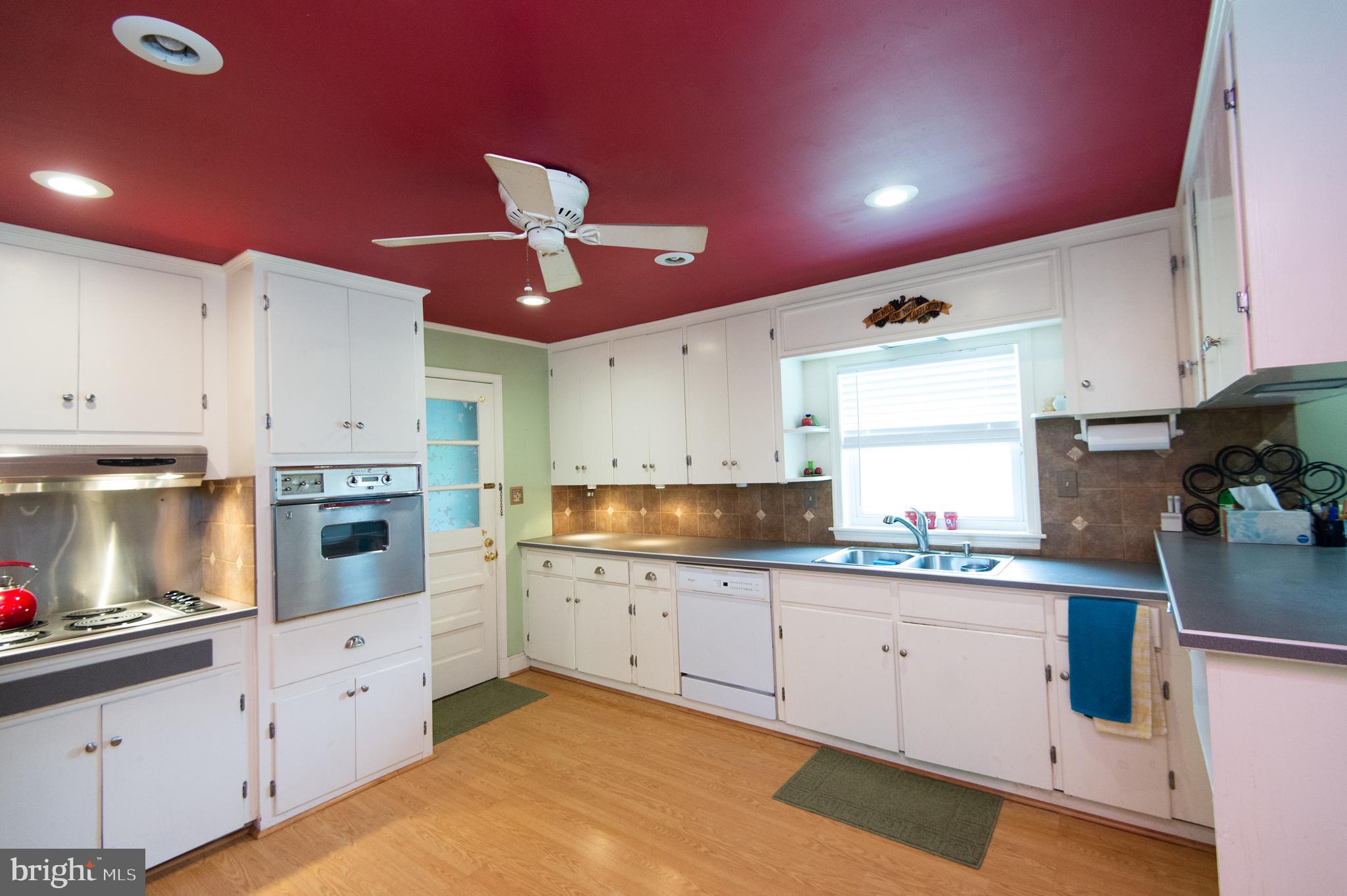 36 Algonquin Road Cambridge, MD 21613 - Photo 18 of 40 a kitchen with granite countertop a sink cabinets stainless steel appliances and a window