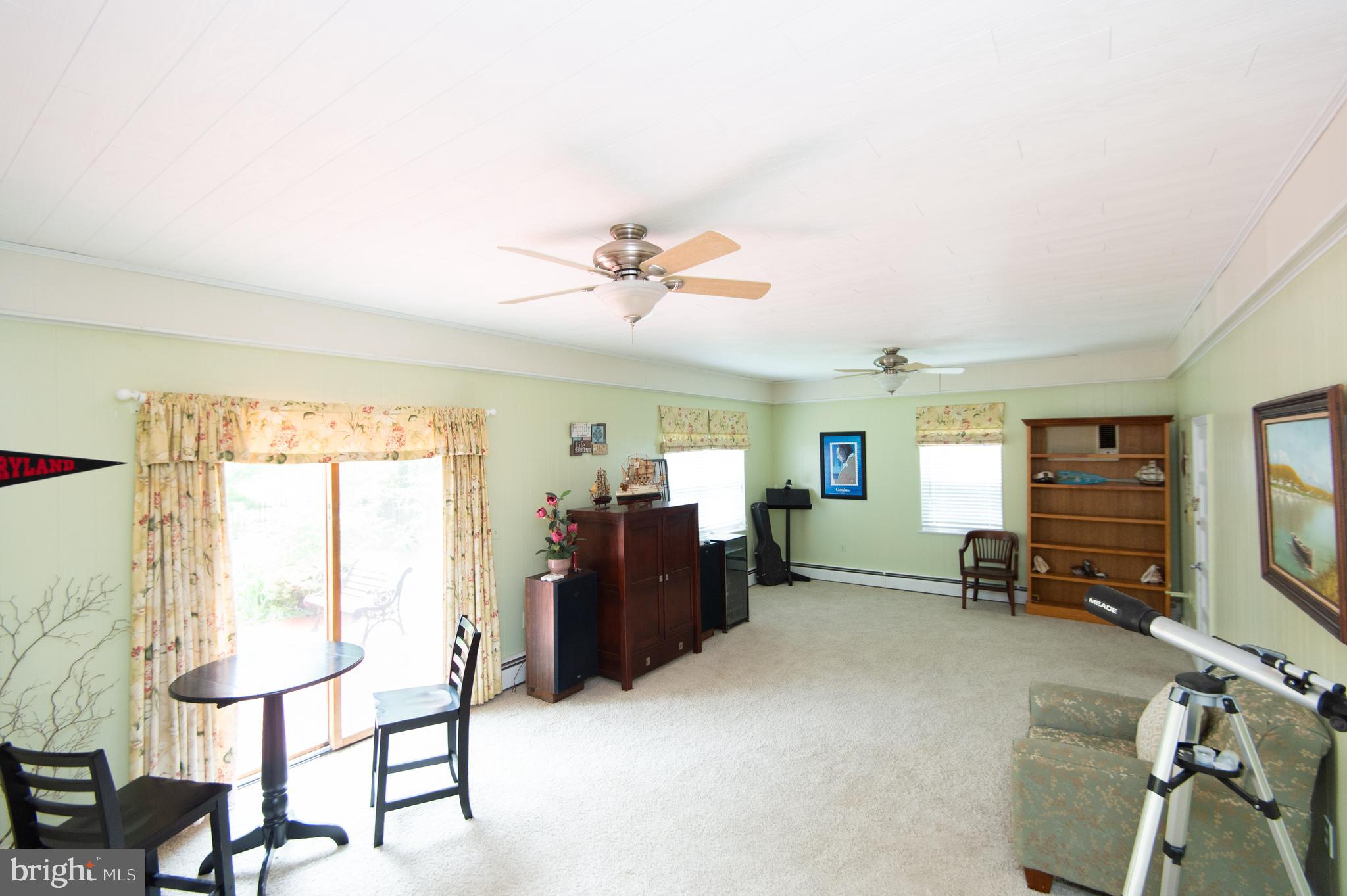 36 Algonquin Road Cambridge, MD 21613 - Photo 22 of 40 a living room with furniture and a flat screen tv