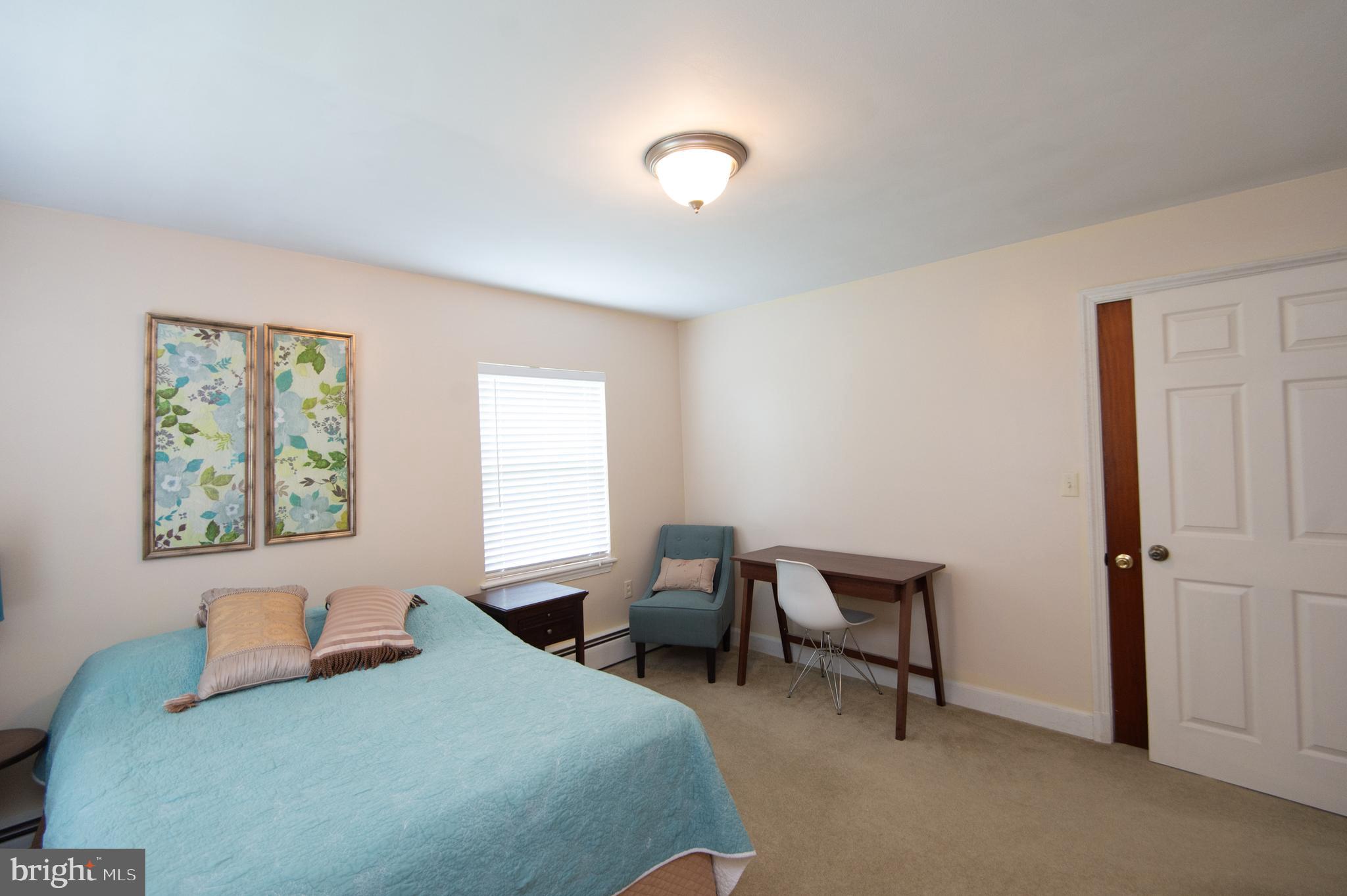 36 Algonquin Road Cambridge, MD 21613 - Photo 28 of 40 a bedroom with a bed and a window