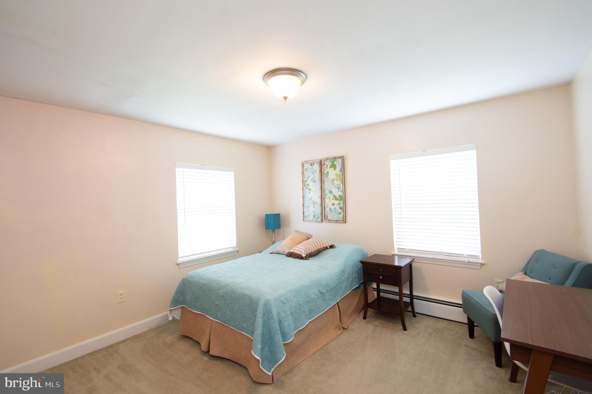 36 Algonquin Road Cambridge, MD 21613 - Photo 29 of 40 a bedroom with a bed and a window