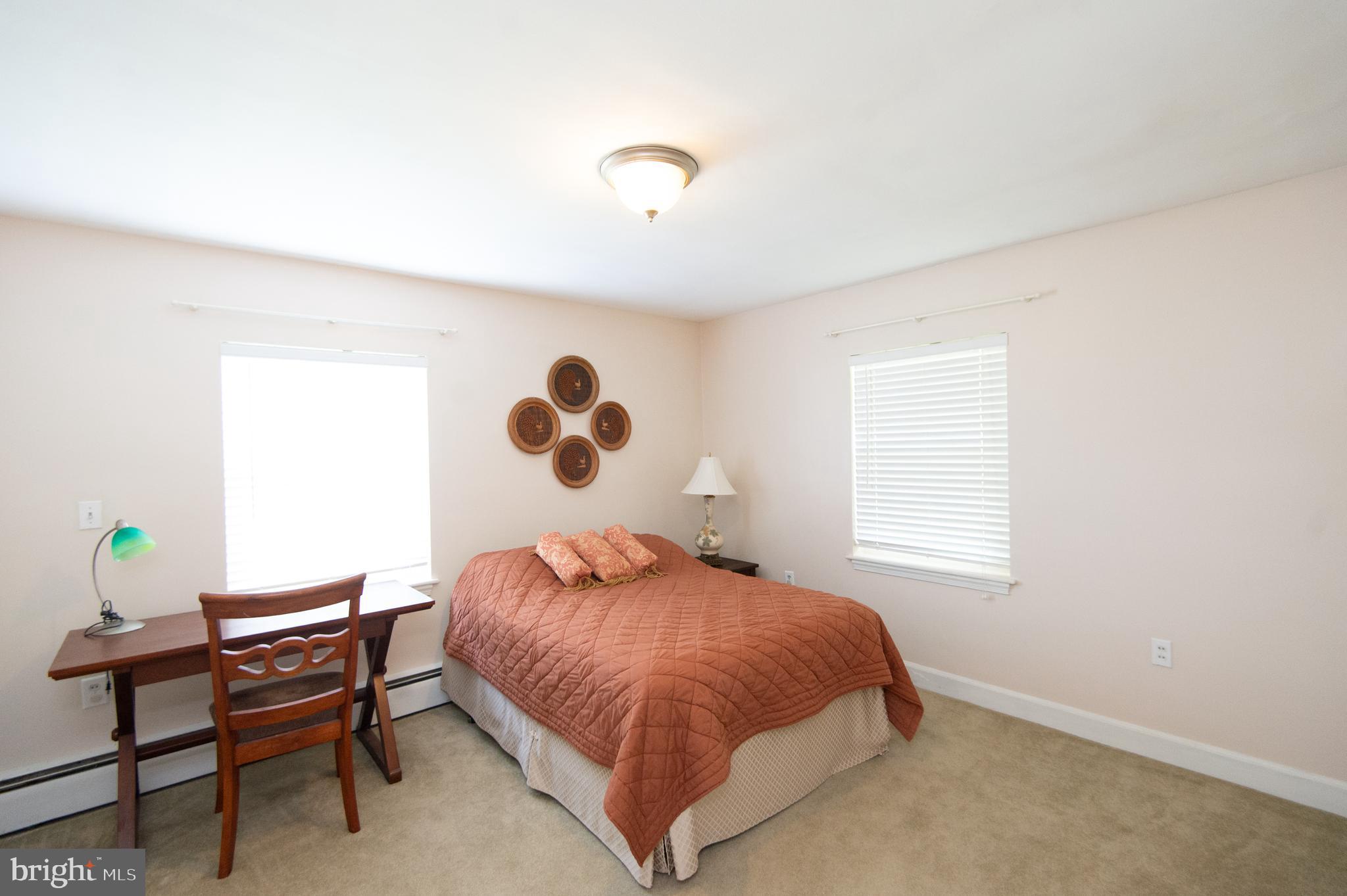 36 Algonquin Road Cambridge, MD 21613 - Photo 30 of 40 a bedroom with a bed and a window