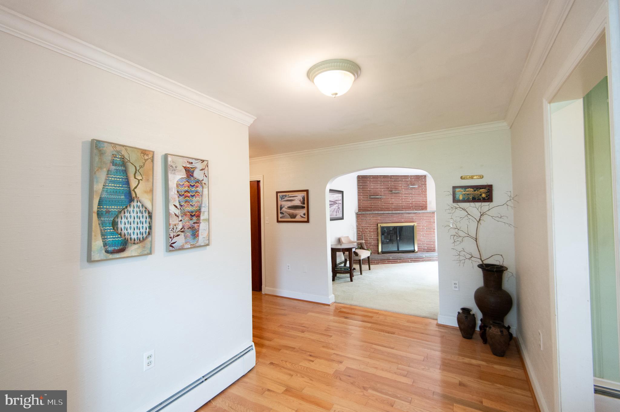 36 Algonquin Road Cambridge, MD 21613 - Photo 4 of 40 a view of a livingroom with hardwood floor and a ceiling fan
