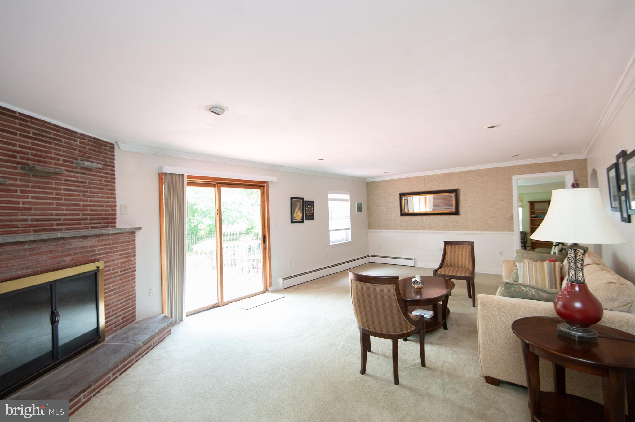 36 Algonquin Road Cambridge, MD 21613 - Photo 6 of 40 a living room with furniture and a fireplace