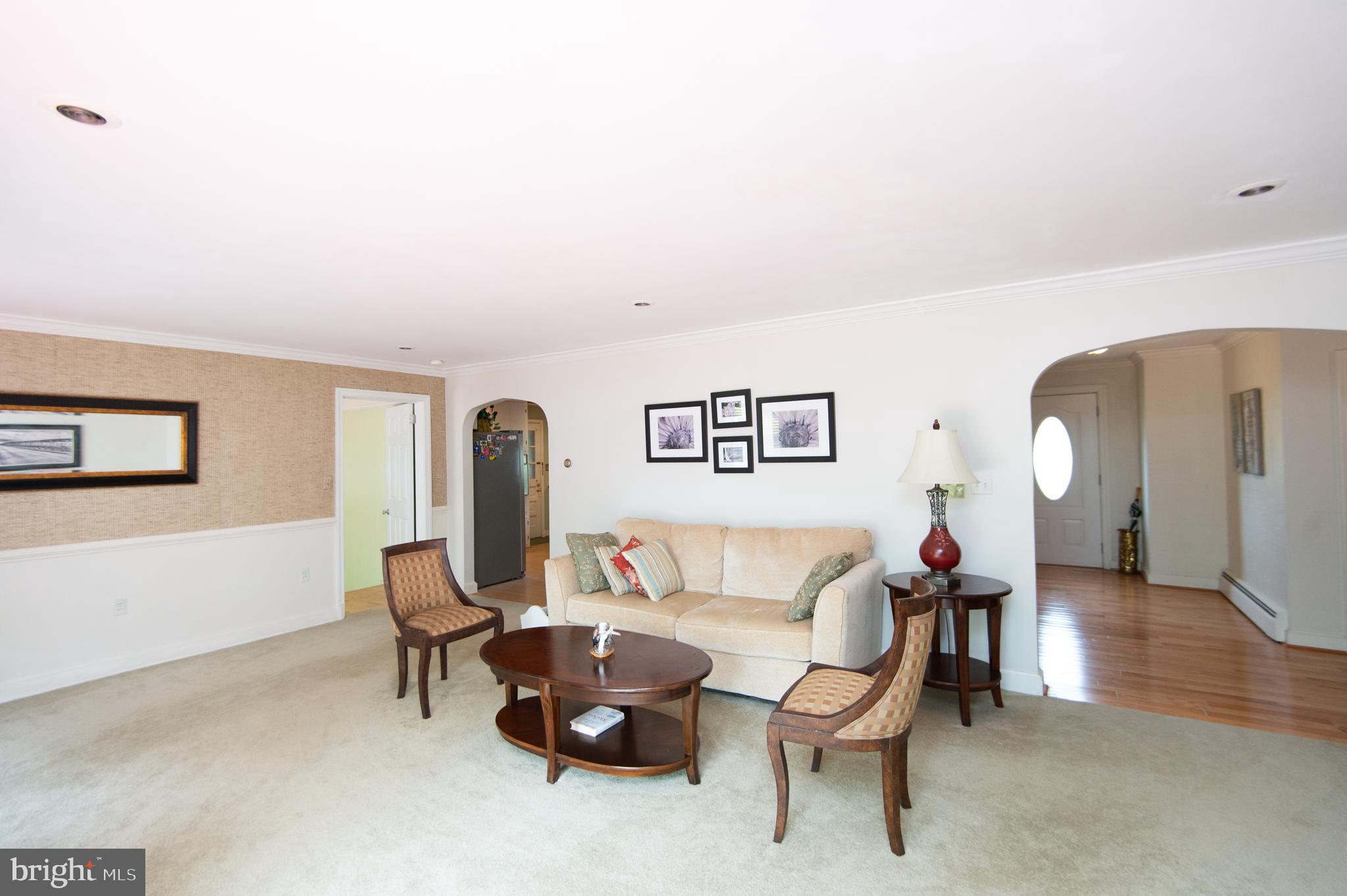 36 Algonquin Road Cambridge, MD 21613 - Photo 8 of 40 a living room with furniture and a wooden floor