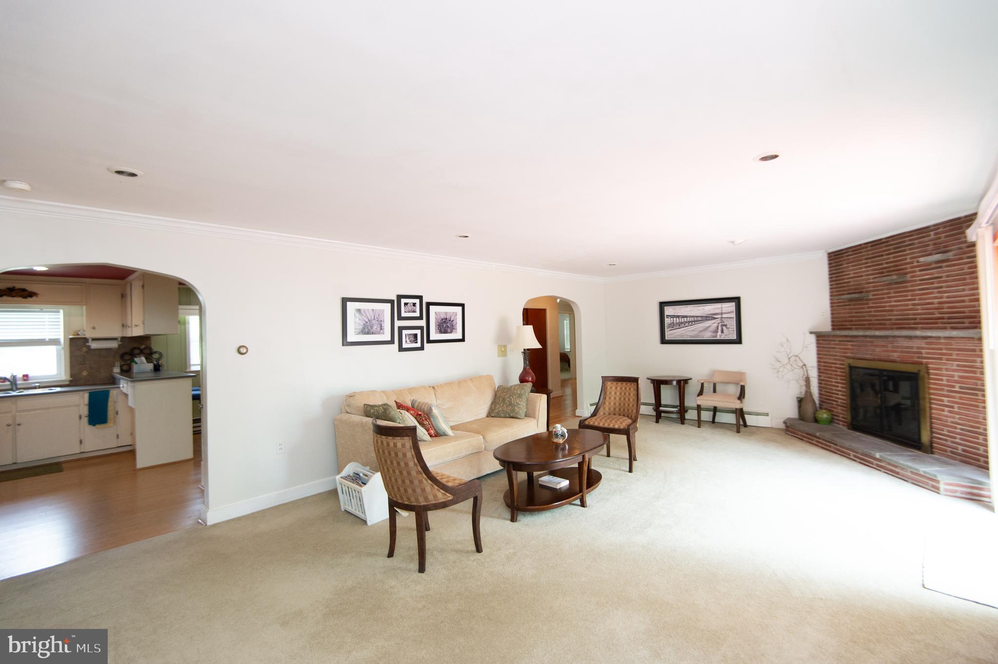 36 Algonquin Road Cambridge, MD 21613 - Photo 9 of 40 a living room with furniture and a fireplace