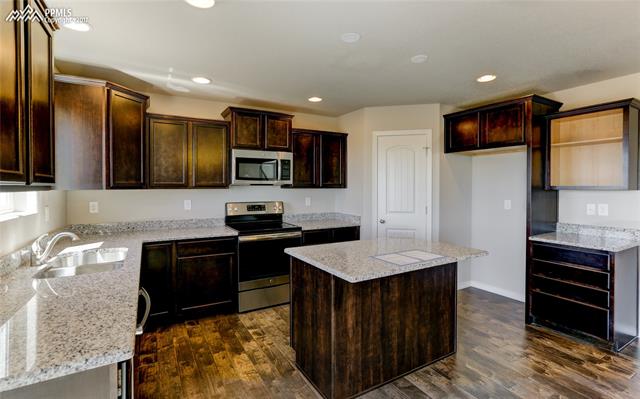 Large kitchen with tons of cabinet space and walk-in pantry 