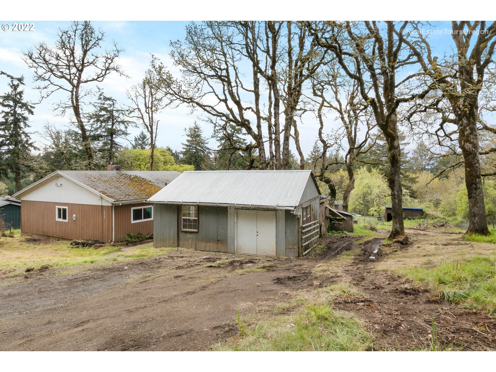 39665 Southwest Gibson Road Gaston, OR 97119 - Photo 22 of 29 a house with trees in the background
