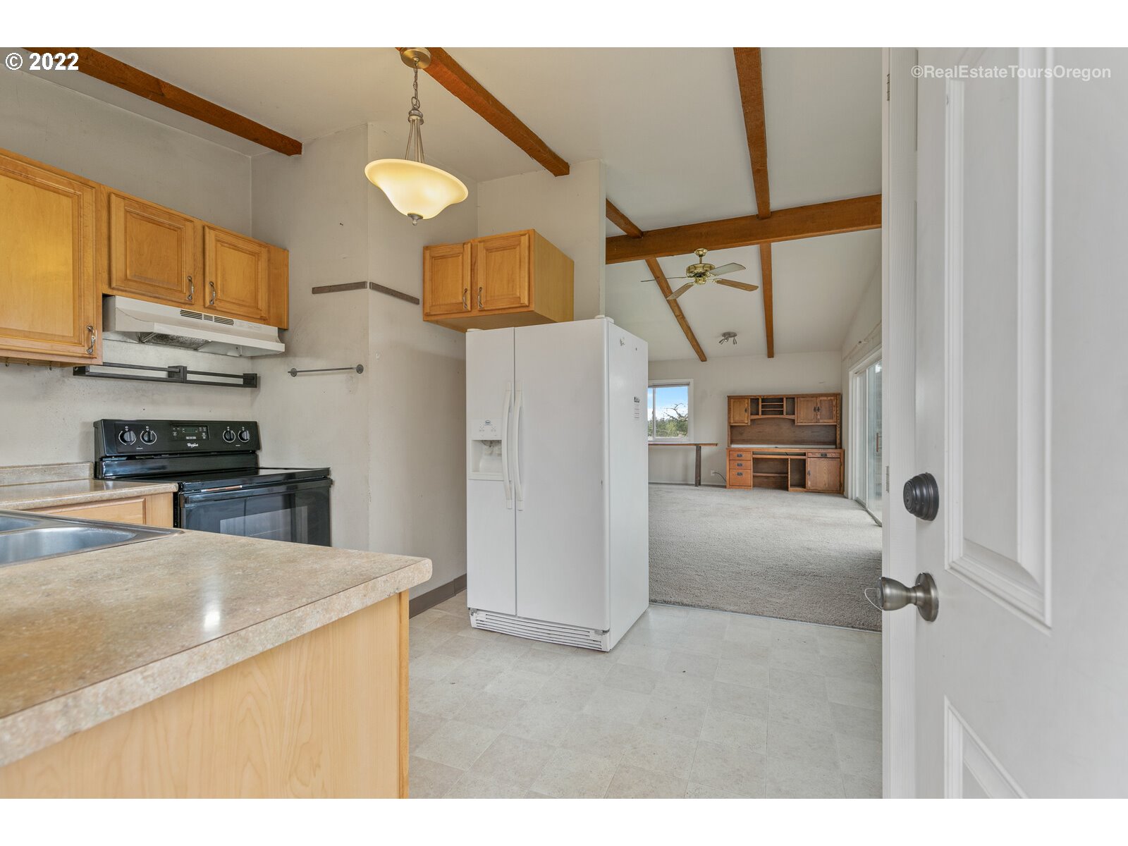 39665 Southwest Gibson Road Gaston, OR 97119 - Photo 23 of 29 a kitchen with kitchen island a counter top space a sink and appliances