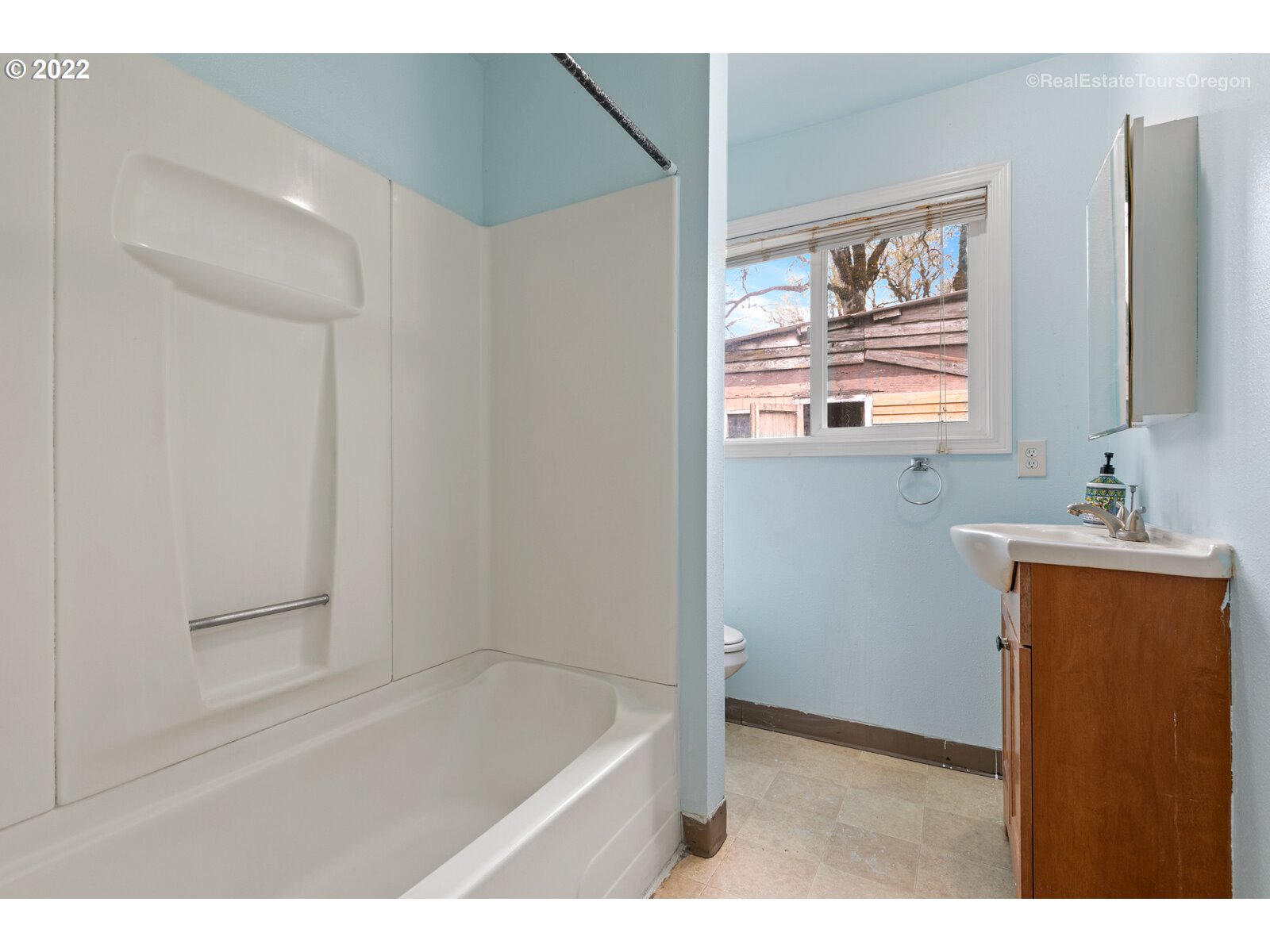 39665 Southwest Gibson Road Gaston, OR 97119 - Photo 5 of 29 a bathroom with a window a sink and a mirror