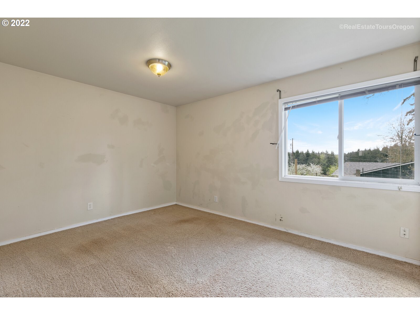 39665 Southwest Gibson Road Gaston, OR 97119 - Photo 9 of 29 a view of an empty room with a window