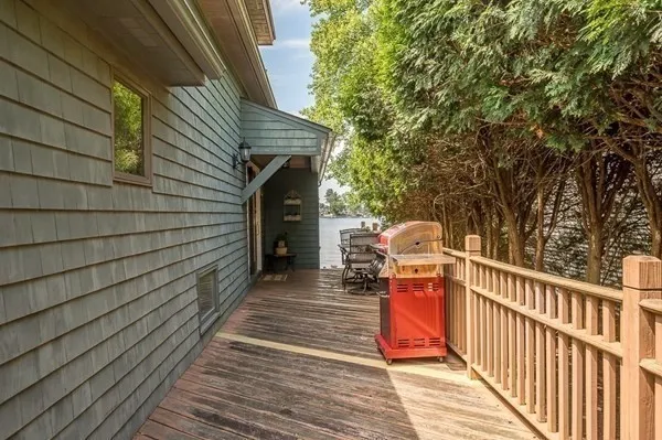 a view of a balcony with wooden floor