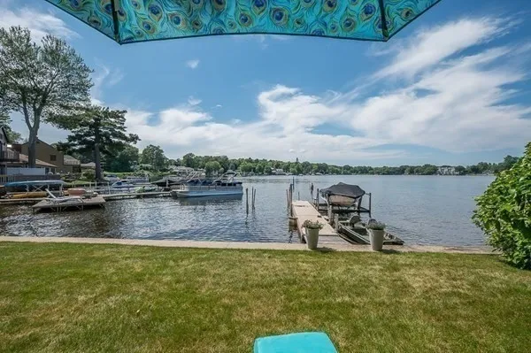a view of a lake with houses in the back