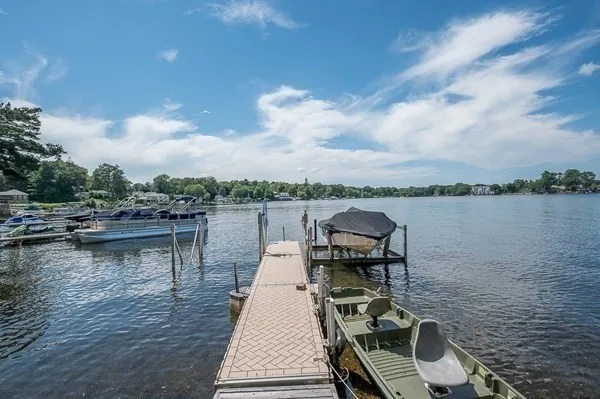 a view of a lake with outdoor seating