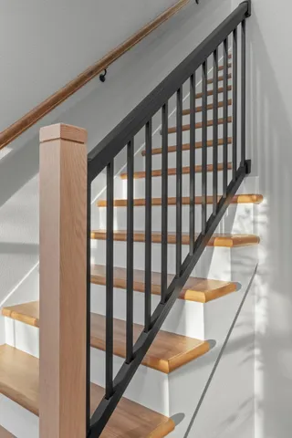 a bathroom with double vanity sinks and a mirror