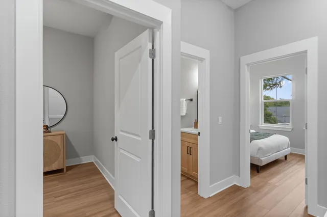 a bedroom with a bed and a lamp