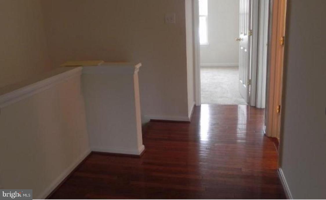 20118 Gunners Terrace Germantown, MD 20876 - Photo 7 of 12 a view of hallway with wooden floor