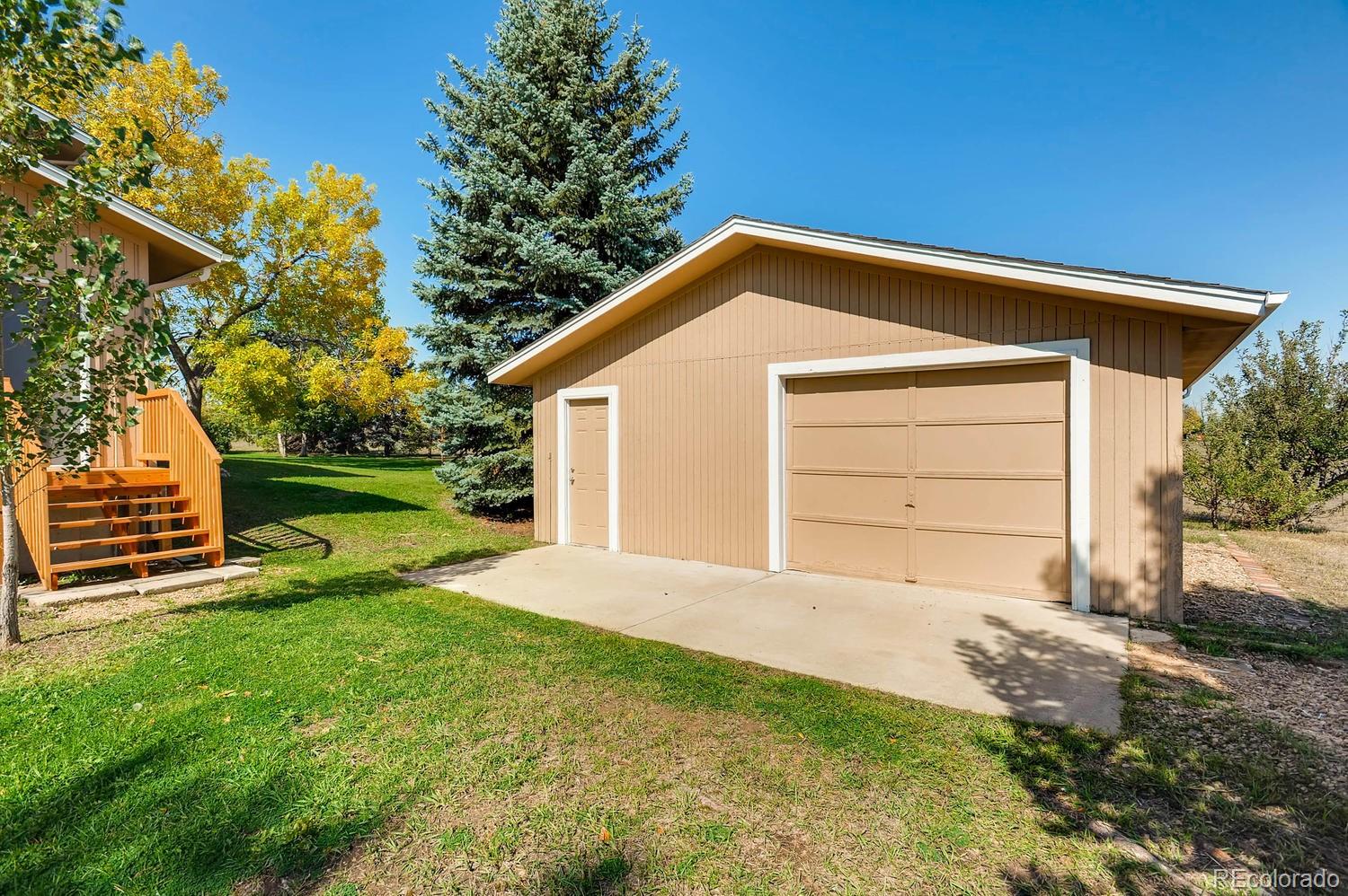9907 Phillips Road Lafayette, CO 80026 - Photo 13 of 31 a view of a house with a yard
