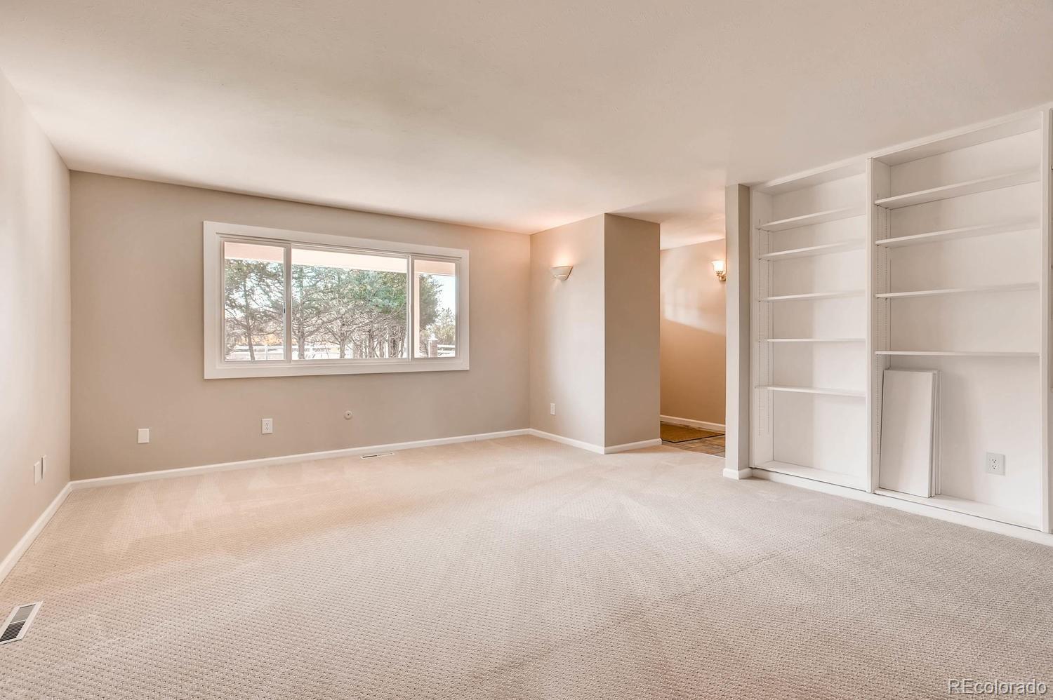 9907 Phillips Road Lafayette, CO 80026 - Photo 24 of 31 a view of an empty room with a window