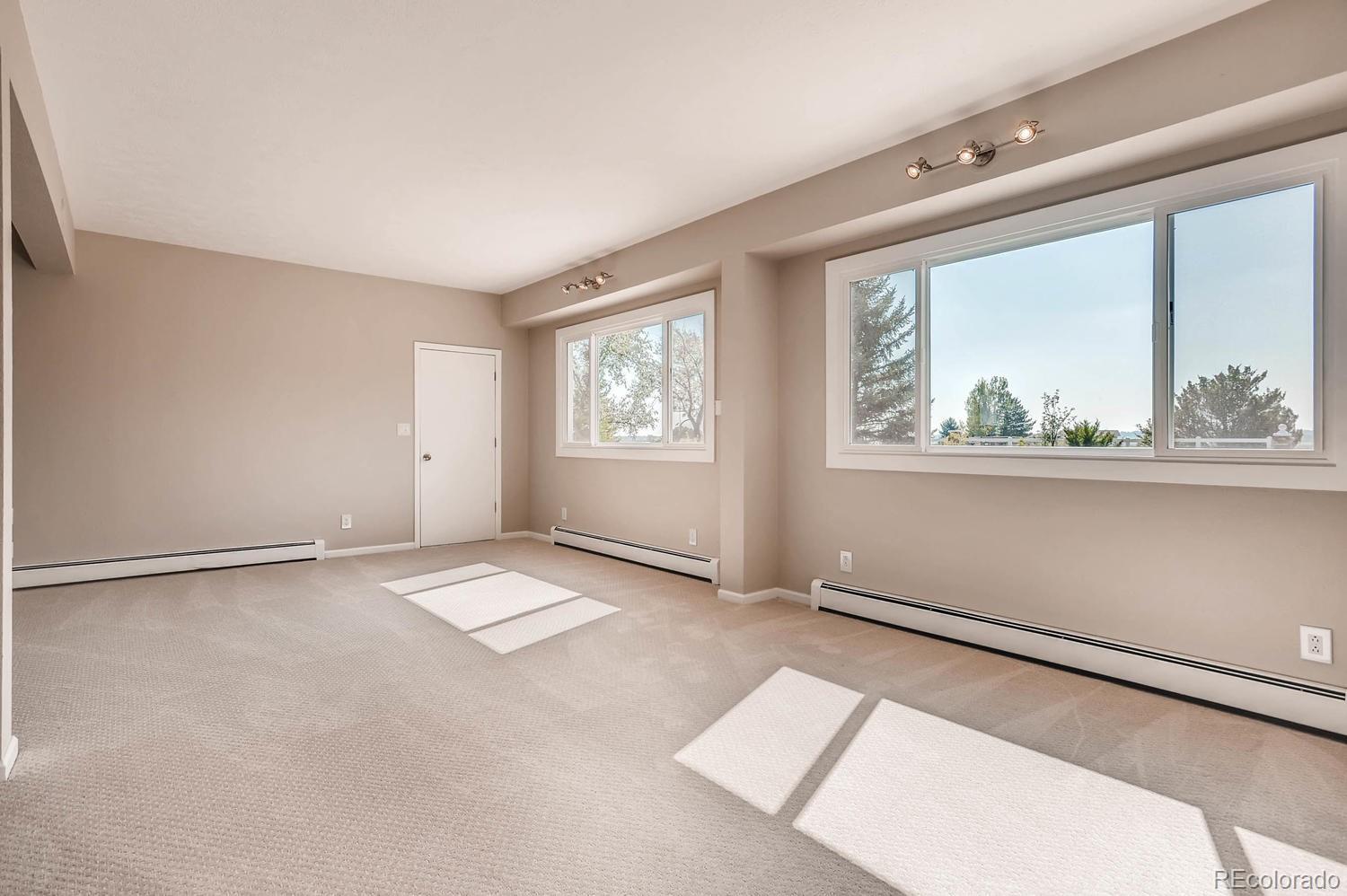 9907 Phillips Road Lafayette, CO 80026 - Photo 25 of 31 an empty room with windows