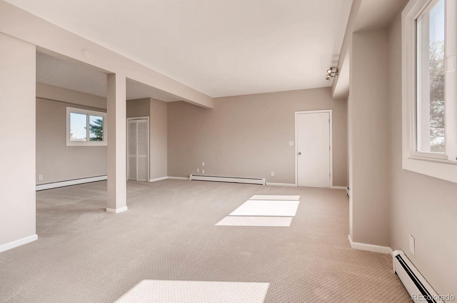 9907 Phillips Road Lafayette, CO 80026 - Photo 26 of 31 an empty room with windows