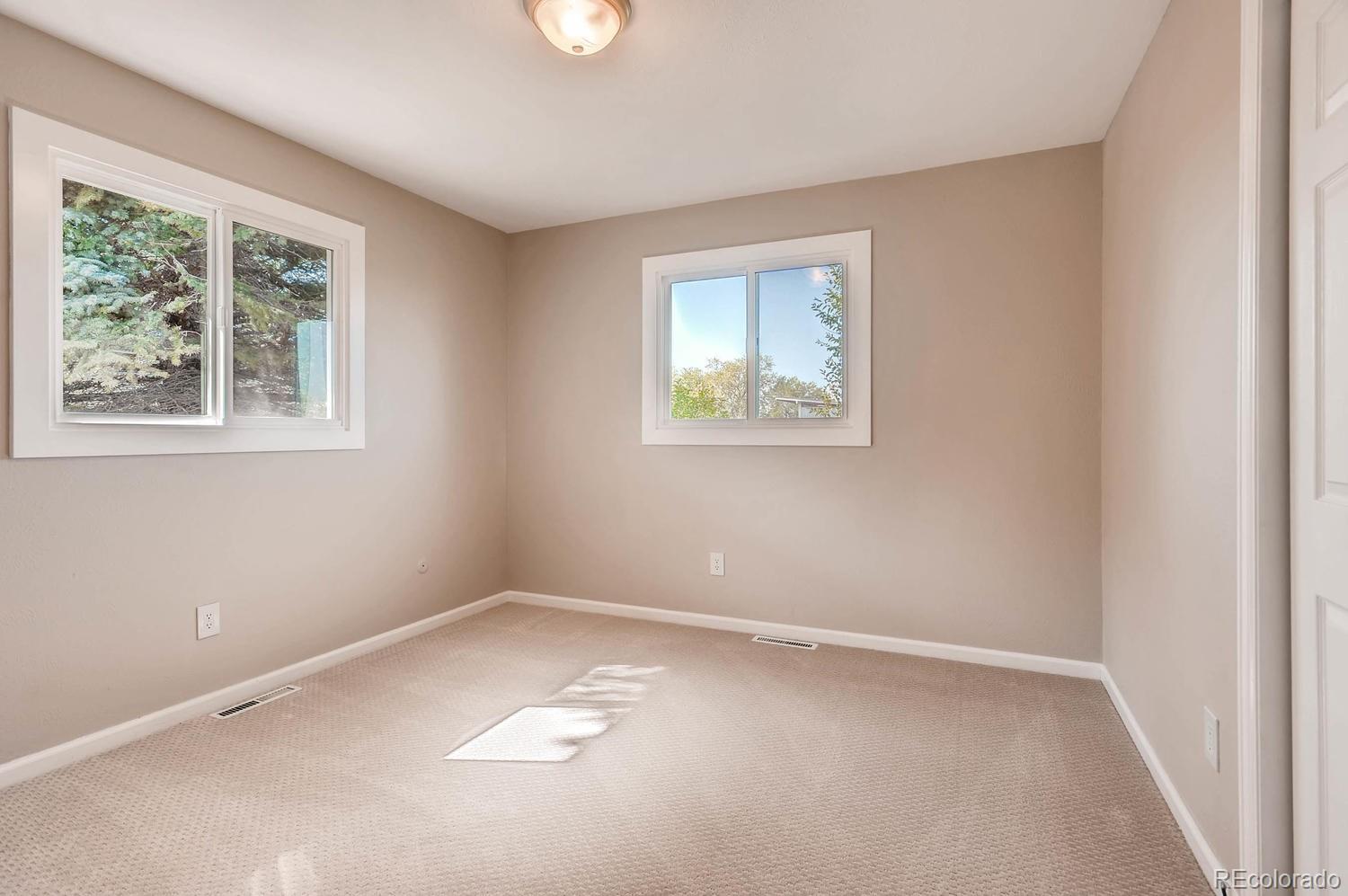 9907 Phillips Road Lafayette, CO 80026 - Photo 28 of 31 an empty room with windows