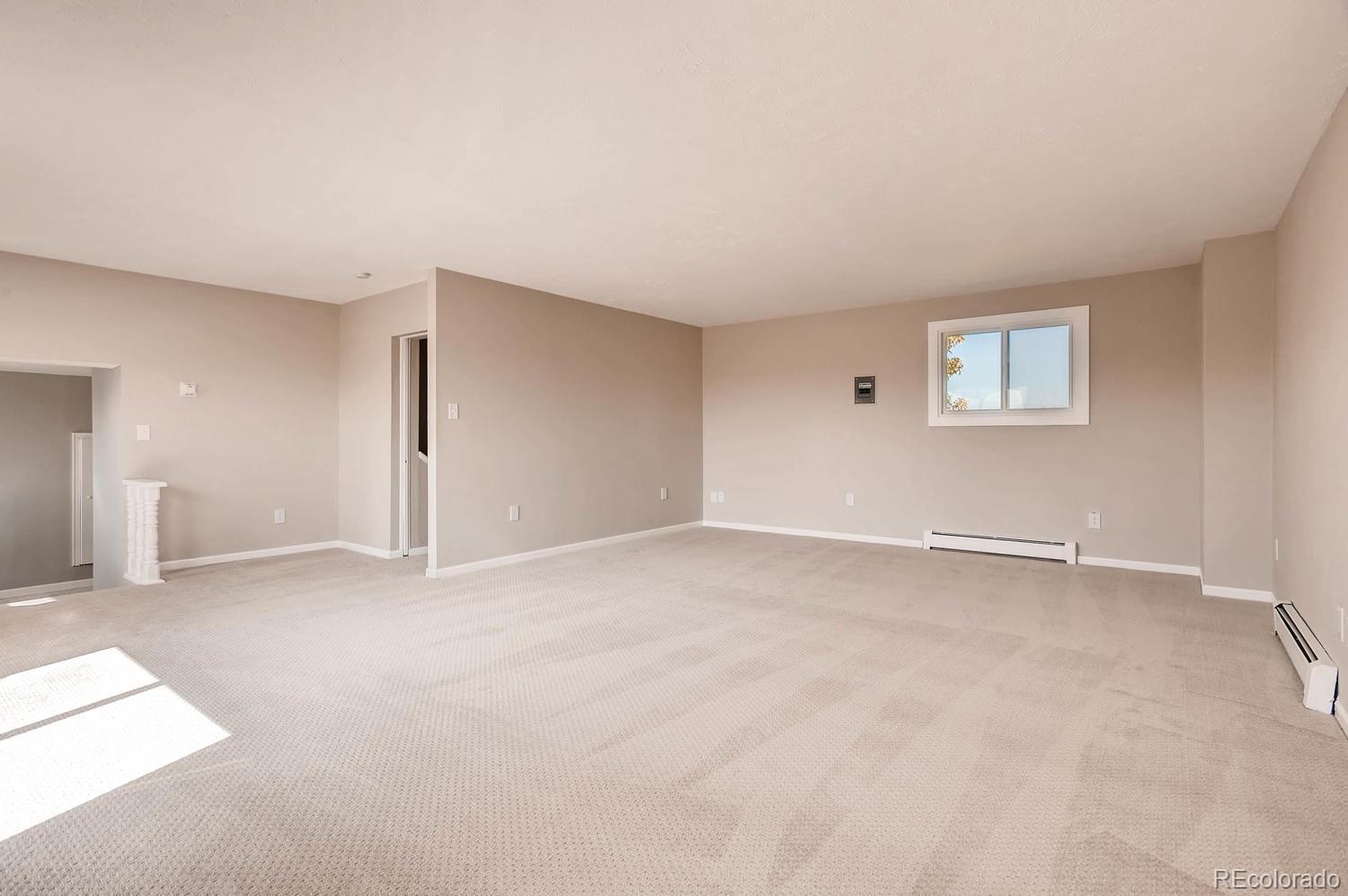 9907 Phillips Road Lafayette, CO 80026 - Photo 30 of 31 a view of an empty room with a window