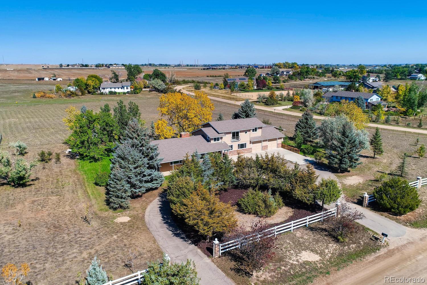 9907 Phillips Road Lafayette, CO 80026 - Photo 4 of 31 an aerial view of a house with a lake view