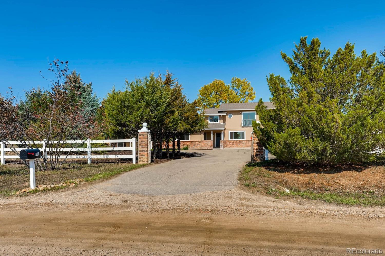 9907 Phillips Road Lafayette, CO 80026 - Photo 7 of 31 a view of a house with backyard and tree