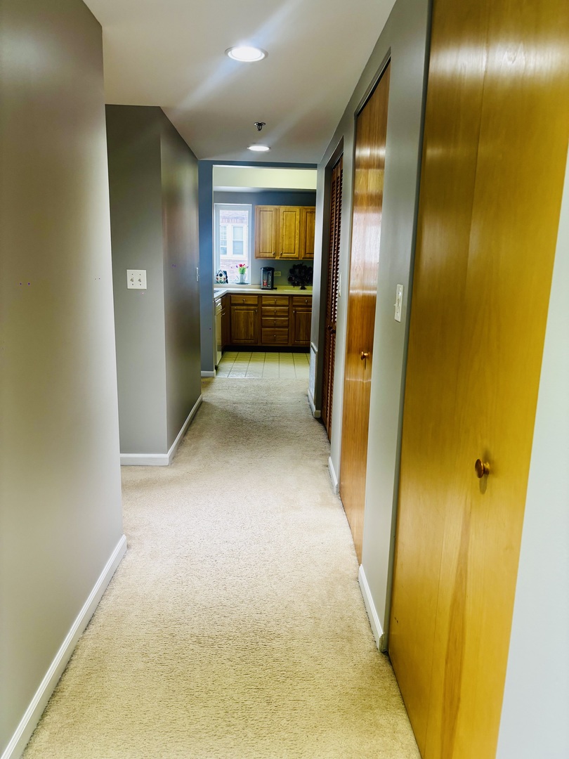 6238 West 26th Street, Unit 201 Berwyn, IL 60402 - Photo 12 of 30 a view of a hallway with furniture and a bathroom
