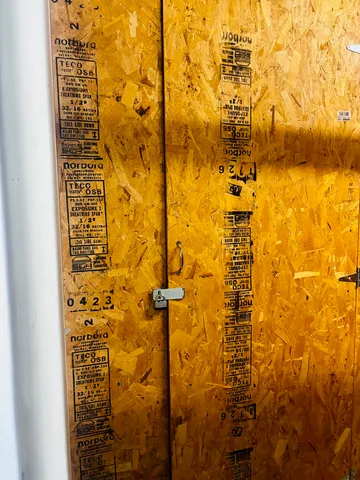 a bathroom with a shower and a glass door