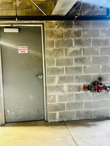 a view of parking garage with cars