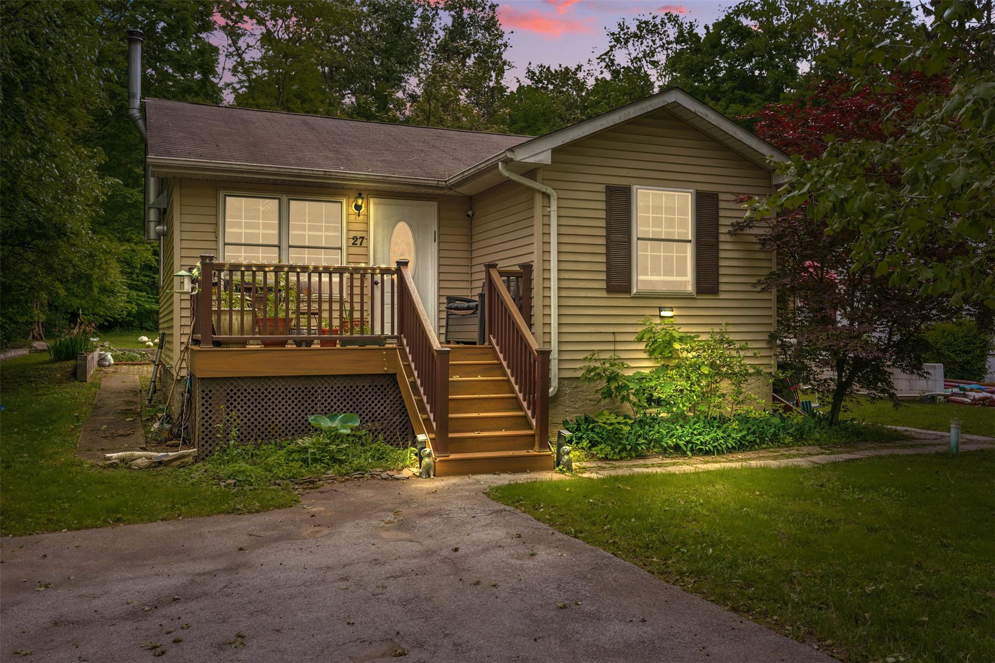 27 Revere Road Monroe, NY 10950 - Photo 1 of 1 View of front of property featuring a front lawn, a wooden deck, and roof with shingles