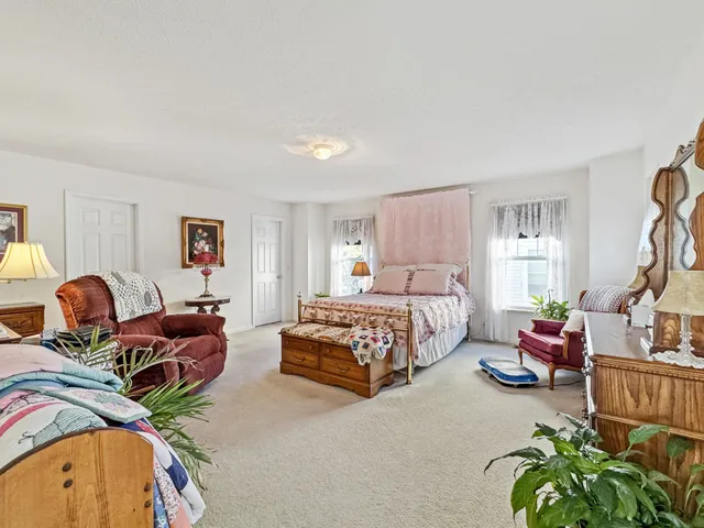 a bedroom with a bed and furniture