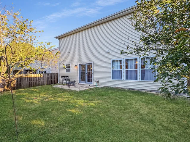 a view of a dirt road with trees in the background