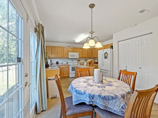 a kitchen with cabinets a sink and appliances