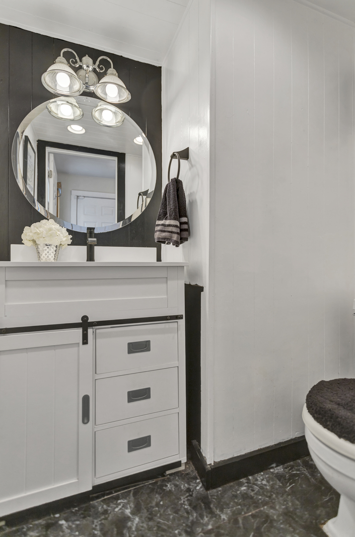 507 Monroe Road Bolingbrook, IL 60440 - Photo 12 of 29 a bathroom with a sink a toilet and mirror