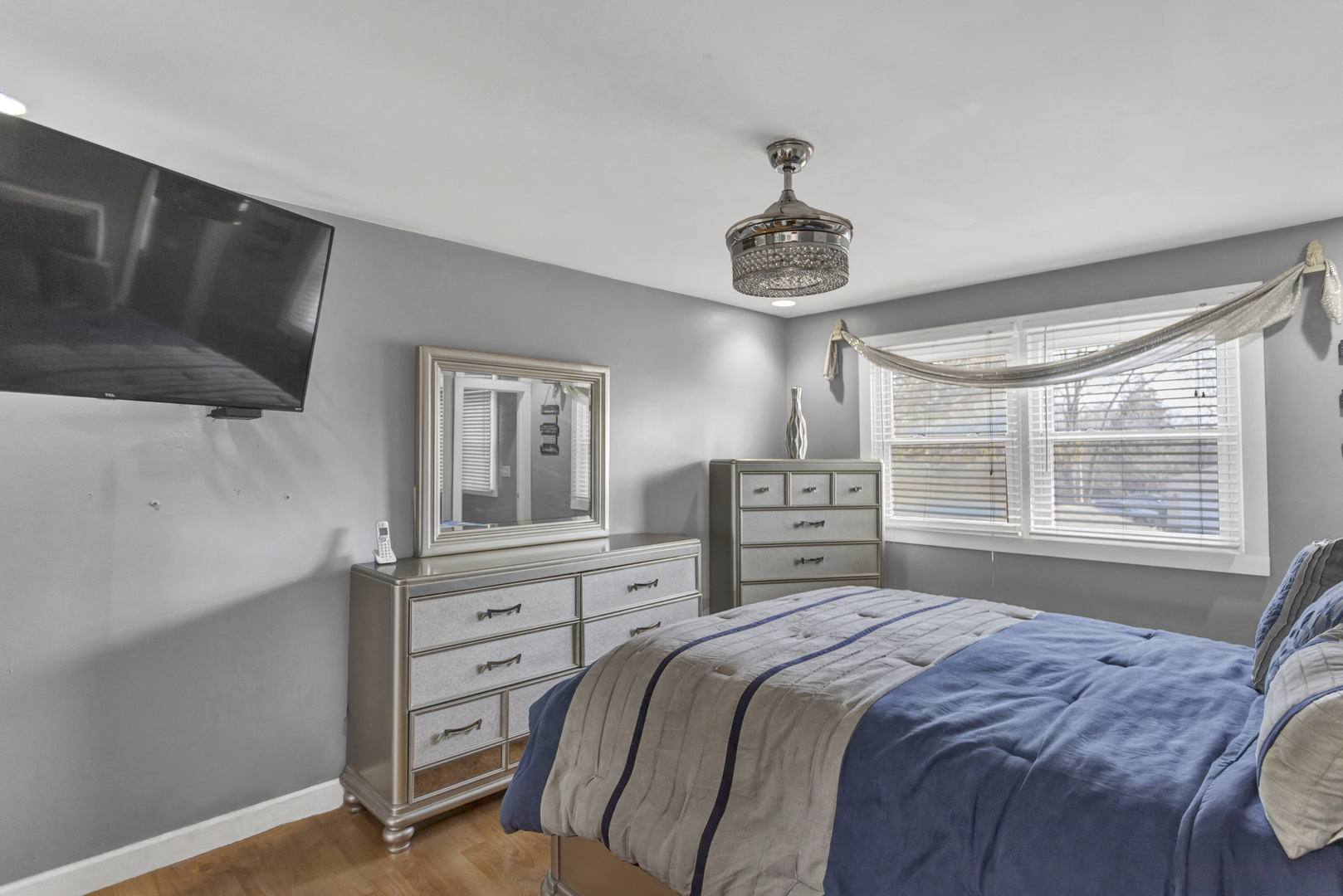 507 Monroe Road Bolingbrook, IL 60440 - Photo 14 of 29 a bedroom with a large bed and a flat tv screen on a dresser