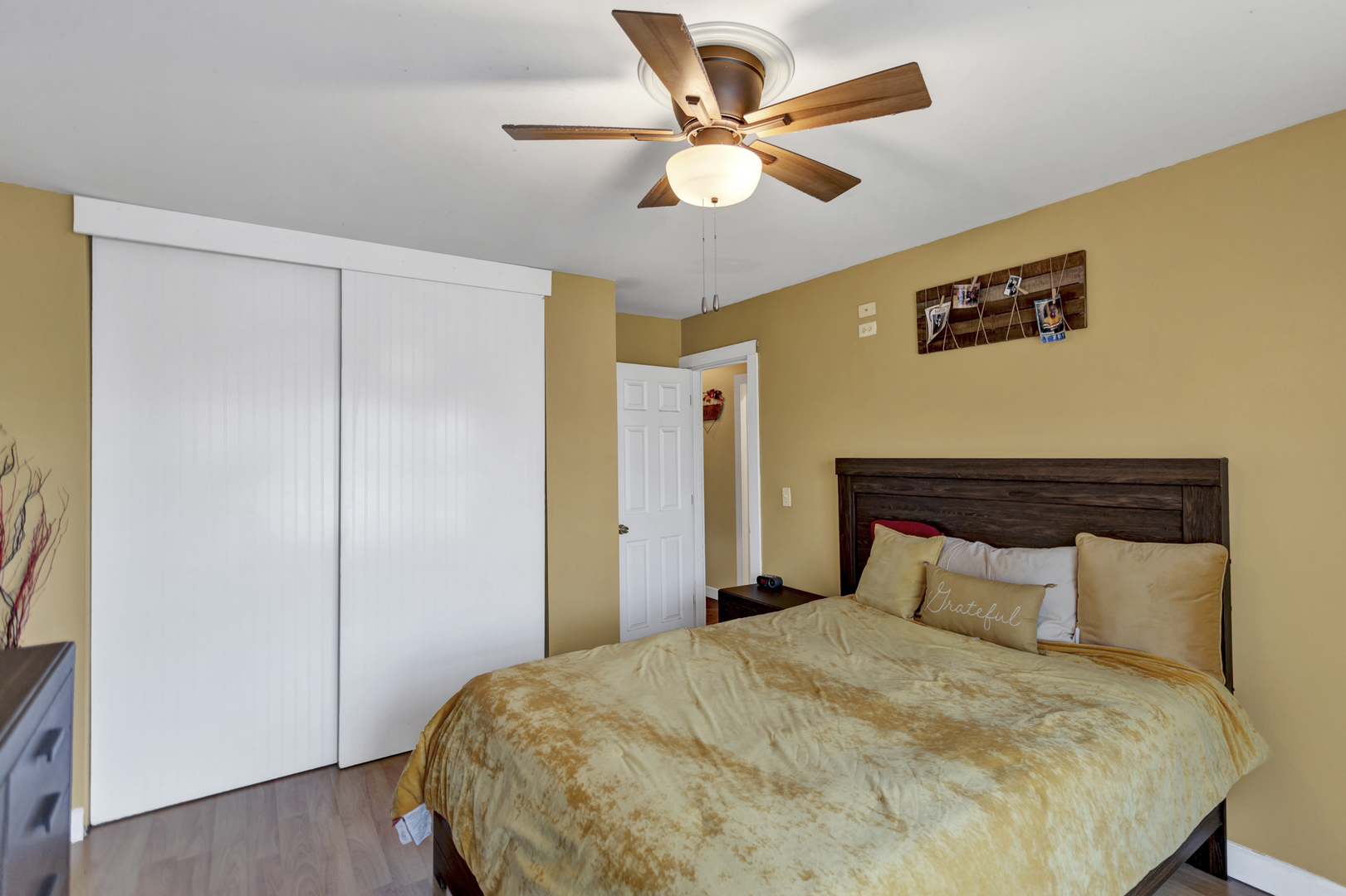 507 Monroe Road Bolingbrook, IL 60440 - Photo 18 of 29 a bedroom with a bed and a chandelier