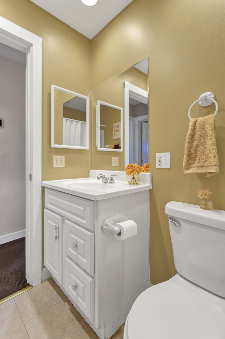 507 Monroe Road Bolingbrook, IL 60440 - Photo 21 of 29 a bathroom with a granite countertop toilet sink and mirror